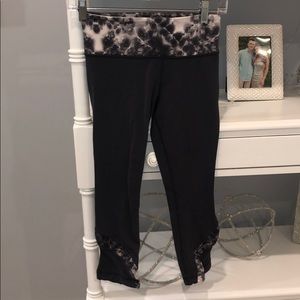 Dark grey lulu leggings with white flowery designs